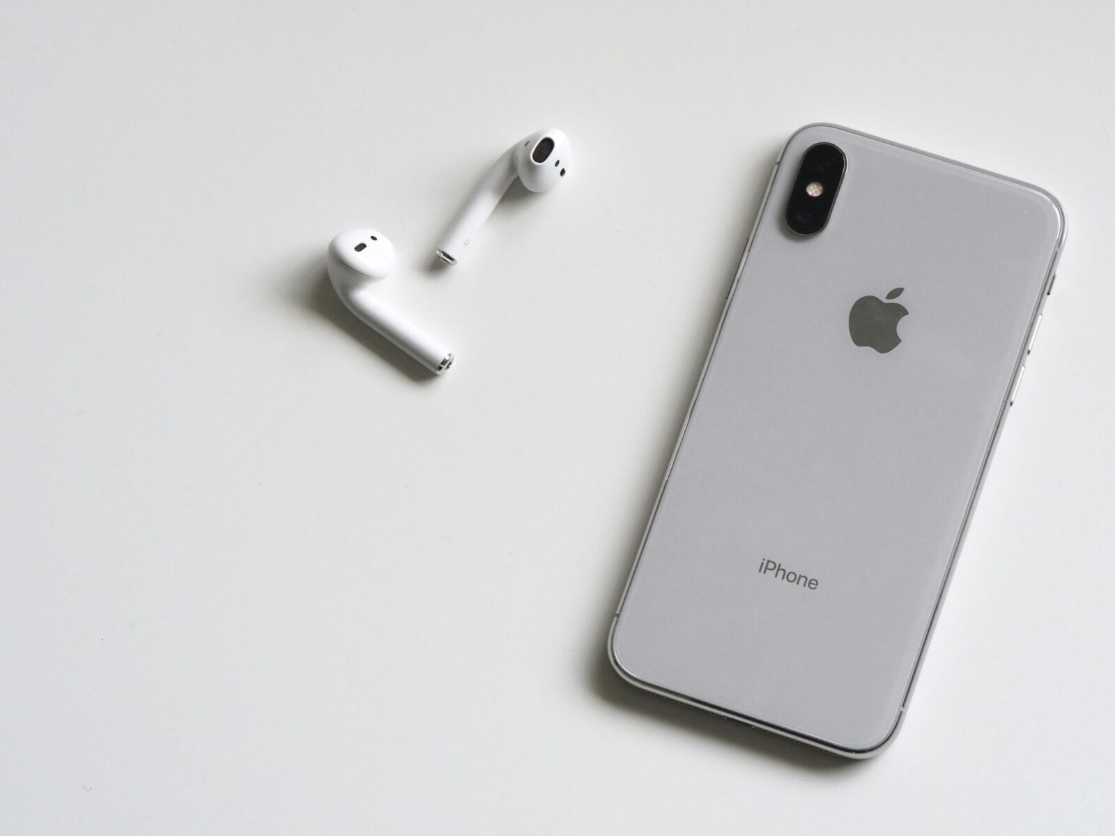 Silver iphone x with airpods. apple gift cards for free